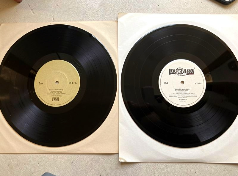 Two pressings of the same album side by side showing different labels