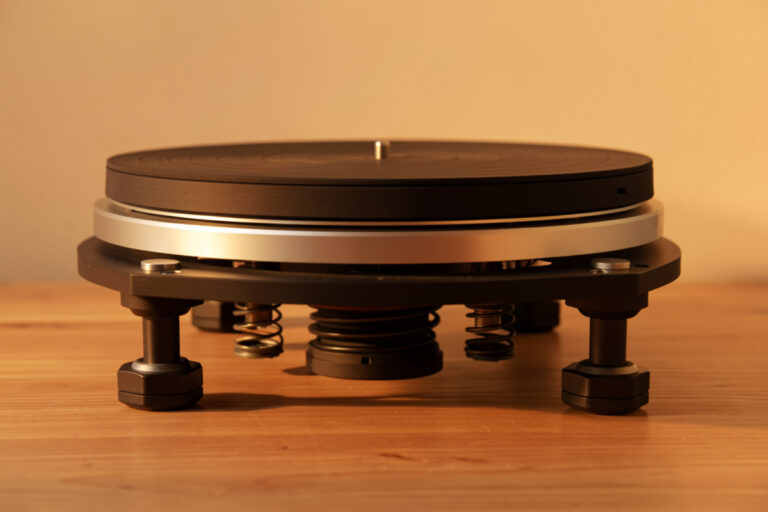 Turntable raised to show isolation feet and spring absorbers