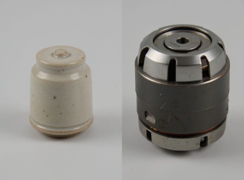 Side-by-side detail of a small ceramic cartridge next to a larger magnetic cartridge body