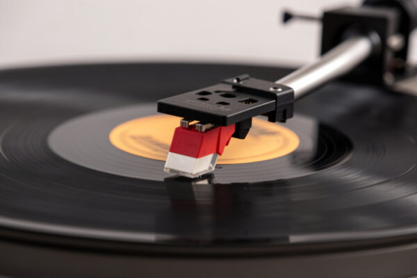 Stylus lifting off a spinning record groove