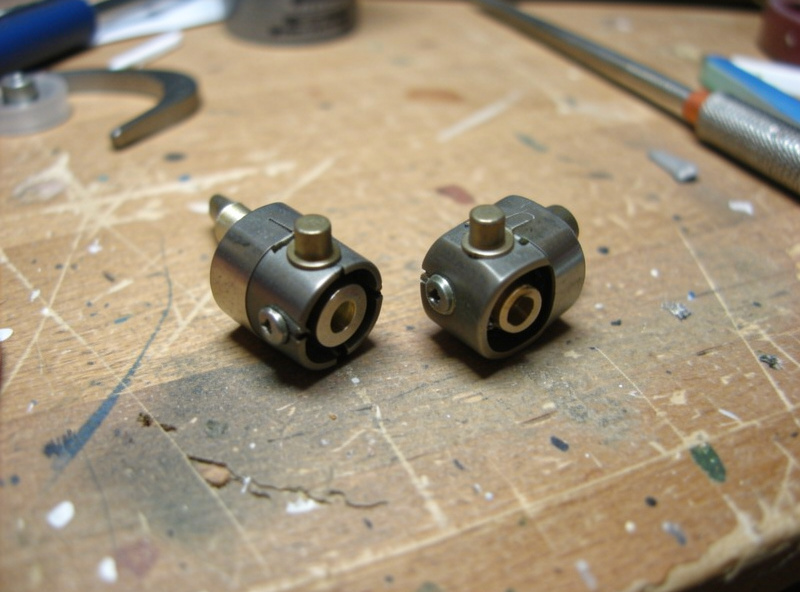 A replaceable moving magnet stylus assembly clipped off a phono cartridge body, shown side by side