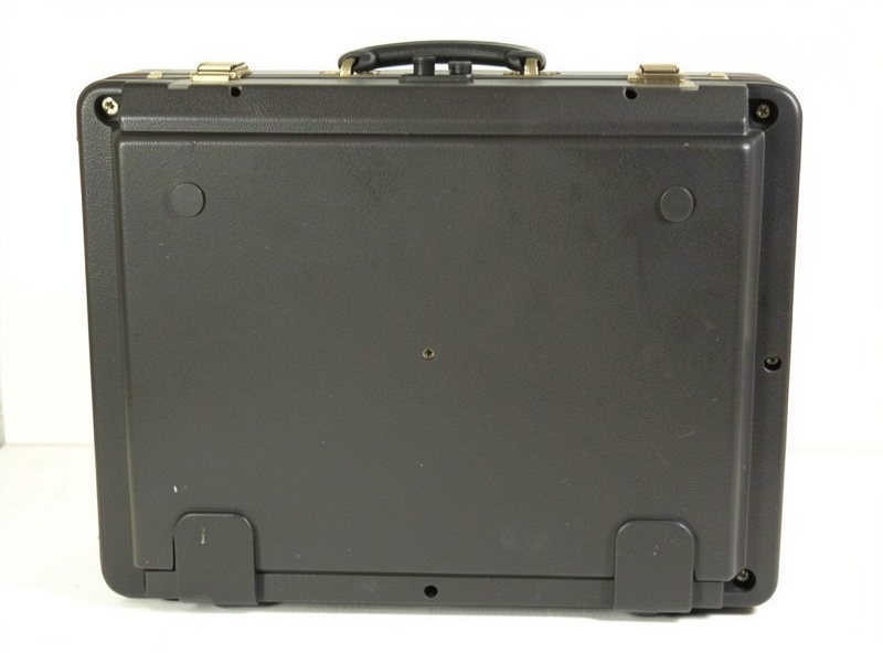 Back of a cheap briefcase-style record player showing the small fixed non-adjustable tonearm